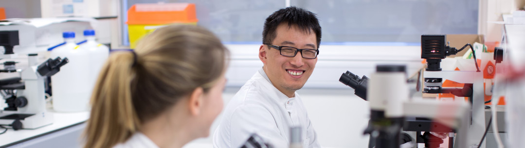 A man and a woman at a lab bench