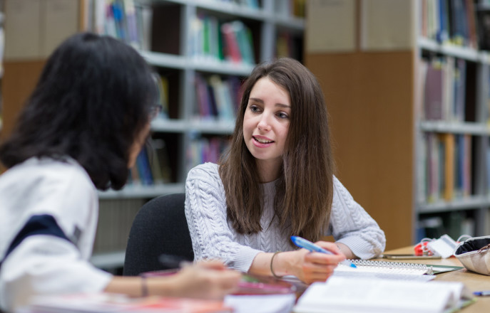 two students in the library