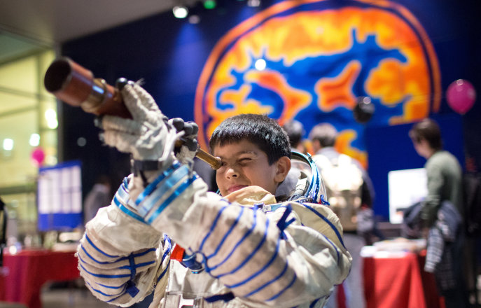 Child with telescope 
