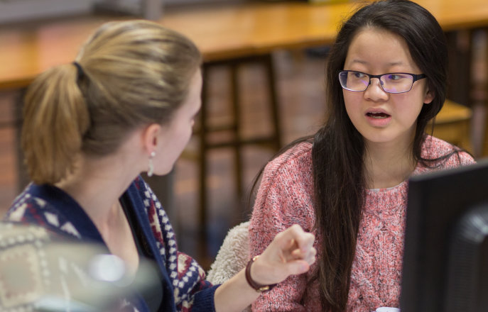 Students discussing their work in the lab