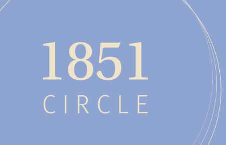 Graphic with 1851 Circle written in cream on a pale blue background
