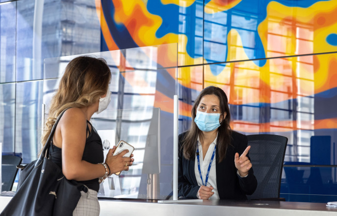 two women at a reception desk