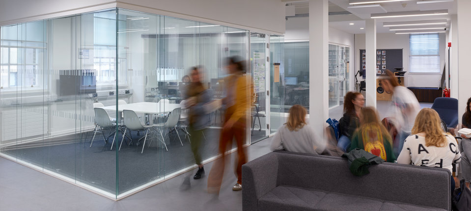 Students in the Dyson school building