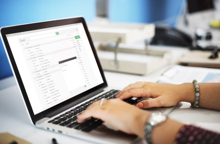 Laptop with hands typing