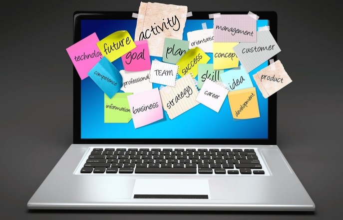 Laptop with sticky notes on the screen