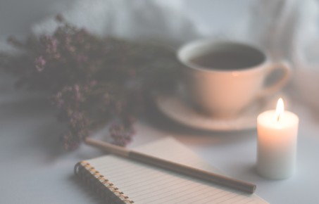 notepad, pen, candle and cup of tea, bunch of lavender