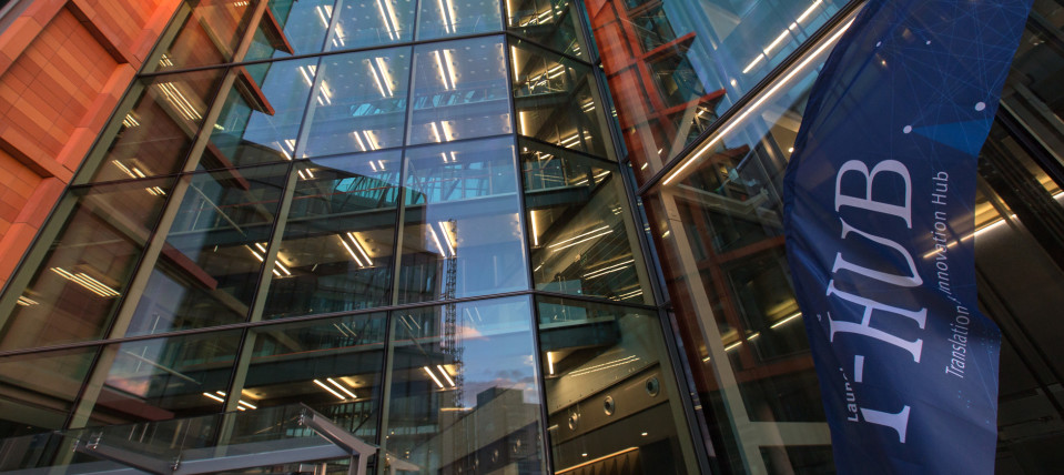 External view of the I-HUB on the White City Campus, a tall glass-fronted building