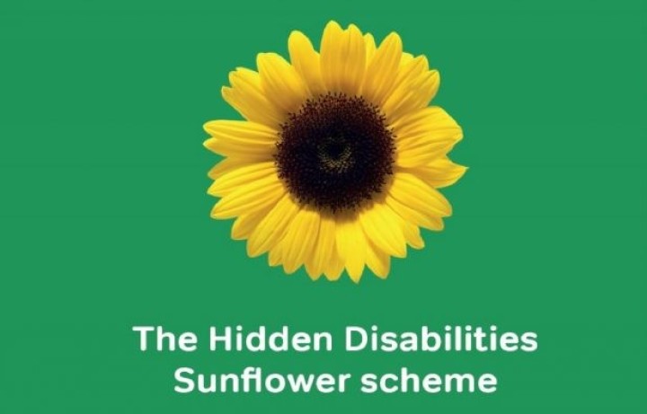 Image of a yellow sunflower on a green background with the words Hidden Disability Sunflower Campaign written in white below