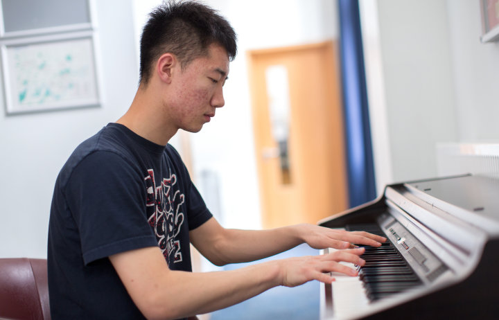student playing piano