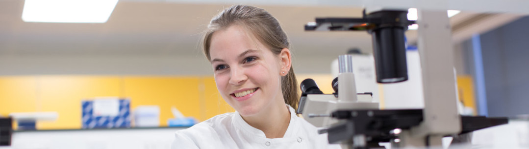 female medical researcher smiling