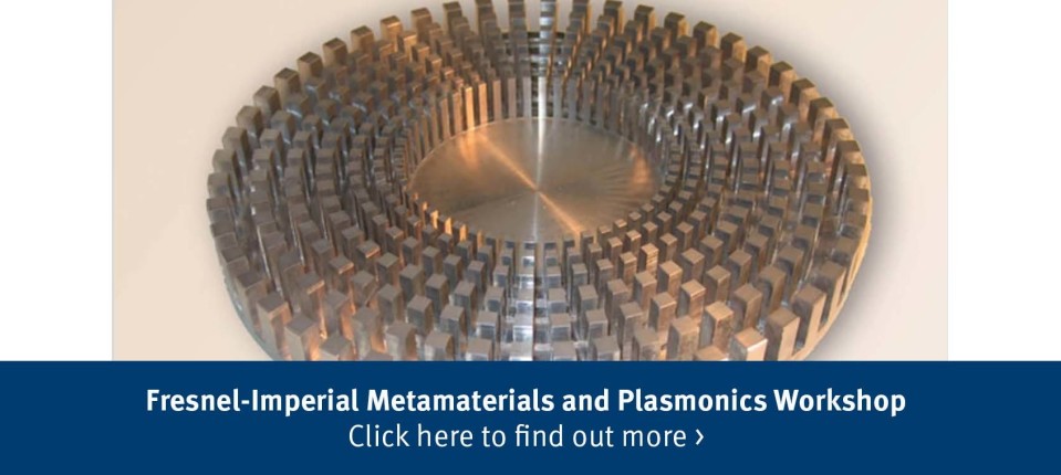 Text says: Fresnel-Imperial Metamaterials and Plasmonics Workshop Click here to find out more > The image behind is related to metamaterials research.