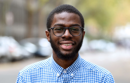 Student smiles at the camera