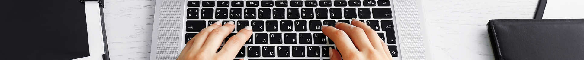 person typing on laptop