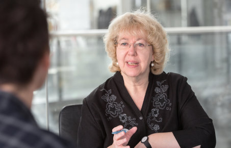 A staff member meeting with Prof Sian Harding