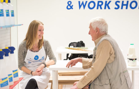 Scientist chats with man at pop-up shop