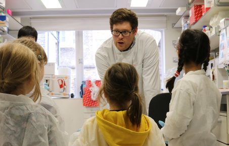 researcher talks to kids