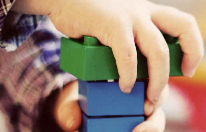 child with toy bricks