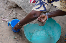 Hands collecting water